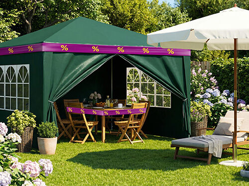Green party tent with wooden dining set inside, wrapped in purple-yellow discount ribbons, umbrella and sun lounger in front, in a big garden. Click to see the products in the offer.