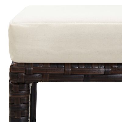 Corner of wicker furniture with beige cushion detailing