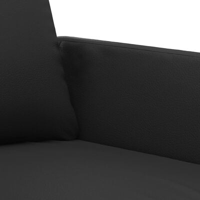 Close-up of upholstery seam and stitching on black leather-like fabric