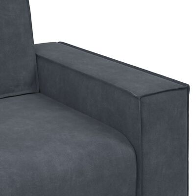 Close-up of right armrest and side of the blue-gray sofa, showing stitching and fabric texture.