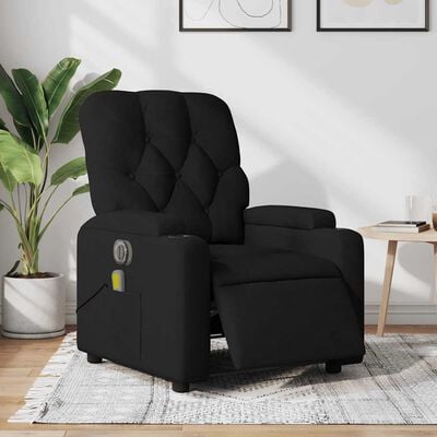 Black upholstered reclining chair in a living room setting with plant and side table