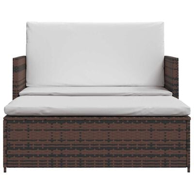 Front view of brown wicker loveseat with white cushions.