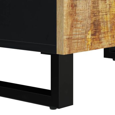 Corner view of a black metal leg base supporting a wood-front cabinet