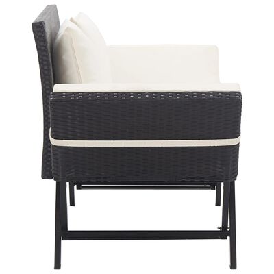 Side view of dark wicker armchair with cream cushions