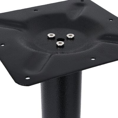 Close-up of plastic/metal foot plate with bolt holes.