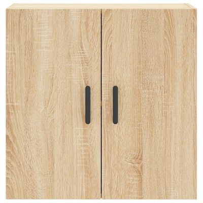 Close-up of two-door wooden cabinet front with black handles