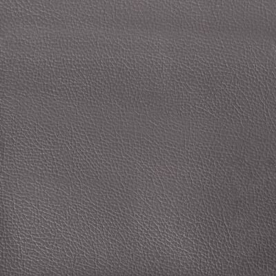 Close-up of gray textured leather-like upholstery material.