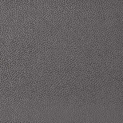 Close-up texture of grey leather upholstery.