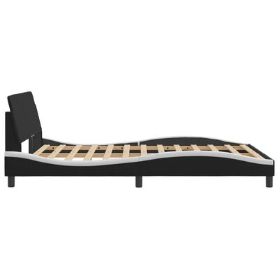 Profile side view of black bed frame with curved white accents and visible slats.
