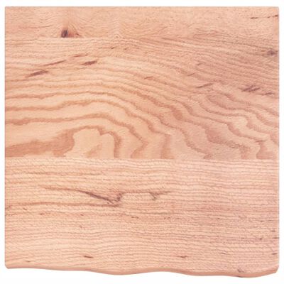 Close-up of wood grain on a square wooden panel or cutting board edge