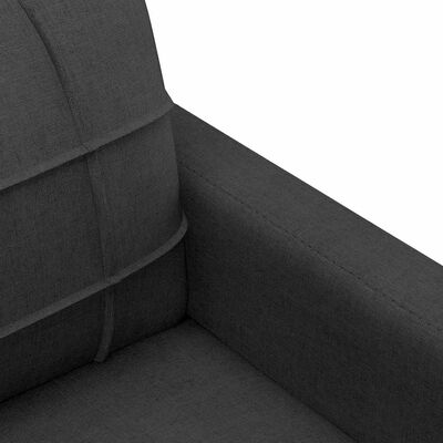 Close-up interior corner of black fabric sofa showing seam and stitching.
