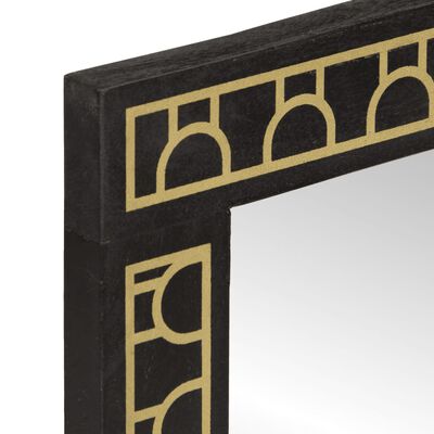 Close-up of the corner of a black frame with gold geometric border detail.