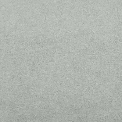 Texture close-up of light gray fabric upholstery with visible soft nap and weave.