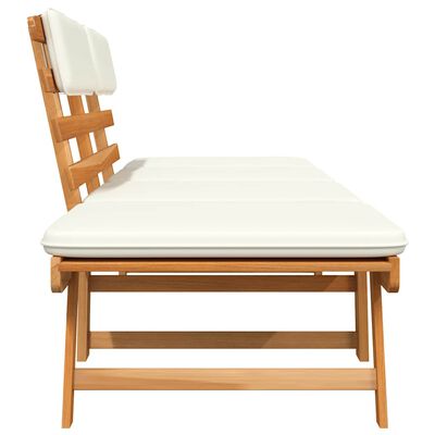 Side view of wooden outdoor bench section with white cushion on top
