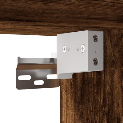 Close-up of metal bracket against wood panel illustrating mounting compatibility.