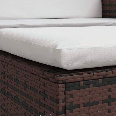 Close-up of mattress-like white cushion on brown wicker base showing stitching.