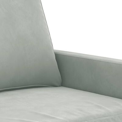 Close-up of light gray sofa arm and seat cushion fabric highlighting texture and stitching.