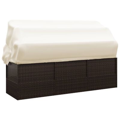 Outdoor wicker storage sofa with beige cushion cover pulled back, showing seating area.