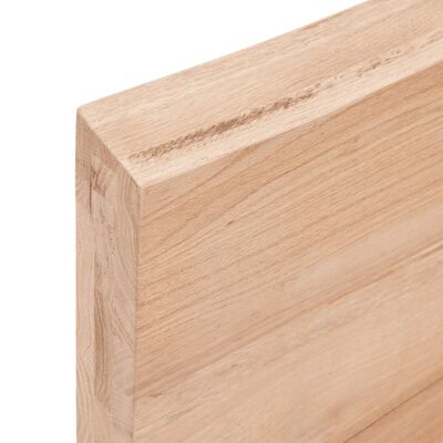 Close-up of end grain and corner of a wooden board.