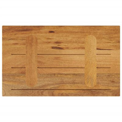 Top view of a wooden cutting board with three slots and two raised slats