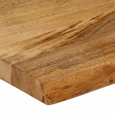 Close-up of the side and edge grain of a wooden cutting board.