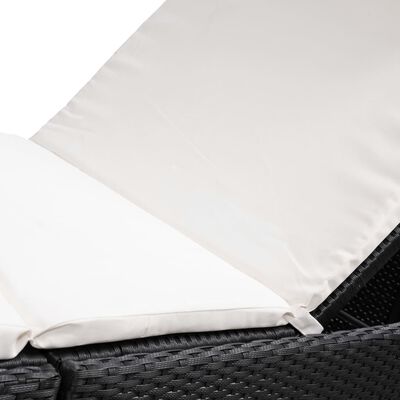 White cushion covers/edging on black wicker outdoor furniture, showing fabric.