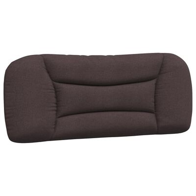 Close-up of brown padded headboard portion of bed.
