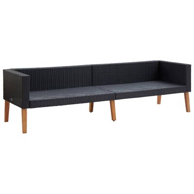 L-shaped outdoor sectional with dark wicker and white cushions, wooden legs, and arms.