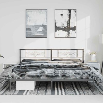 Bedroom with metal bed frame featuring headboard with decorative panels, two framed artworks, and two nightstands.