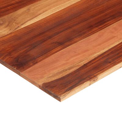 Close-up corner of a striped wooden cutting board showing edge and wood grain.