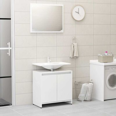 White bathroom vanity with sink, cabinet under, washing machine and wall mirror.