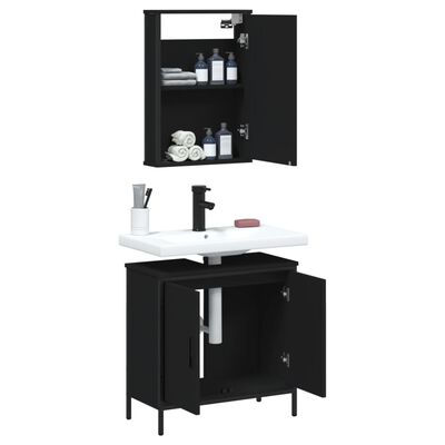 Open wall cabinet above white sink and lower black vanity with doors open showing storage and plumbing