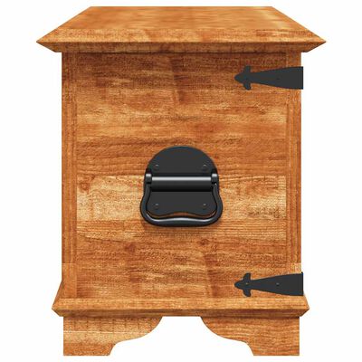 Close-up of the front of a wooden storage chest showing black metal latch