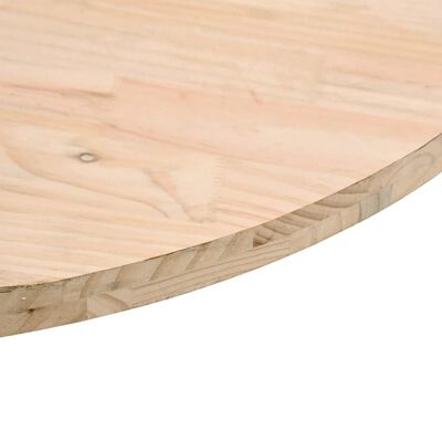 Close-up of the curved edge of a wooden round board showing layered plywood edge.