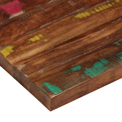 Close-up of the edge and corner of the painted cutting board with teal and yellow paint