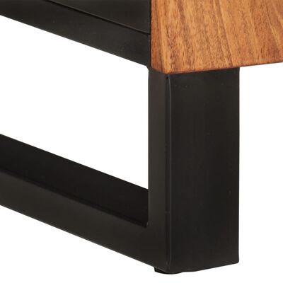 Corner of black cabinet frame with wooden top edge and leg, showing construction joinery.
