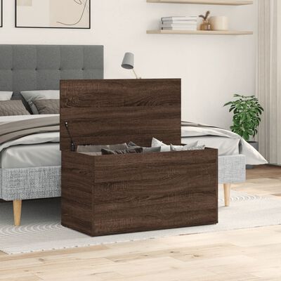 Wooden storage chest in front of bed and decor, closed lid showing wood grain