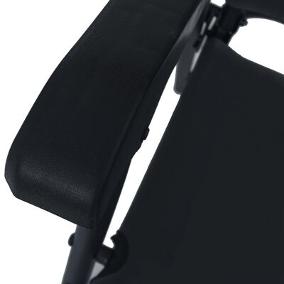 Close-up of the armrest and edge of the seat on the folding chair.