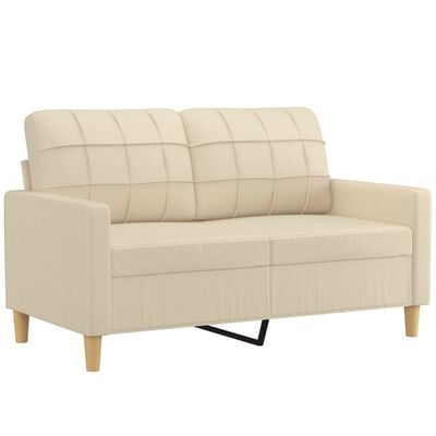 Beige loveseat/small sofa with grid-stitched back and visible black metal leg.