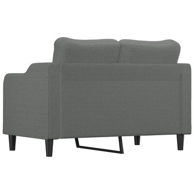 Back view of a grey sofa showing solid upholstery and metal support leg.