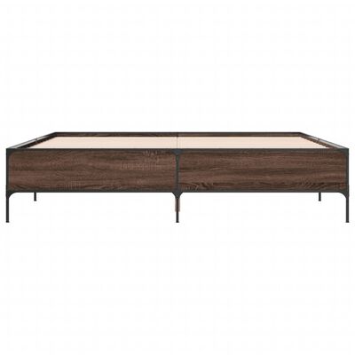 Front view of a wooden platform bed frame with metal legs and a visible slat base.