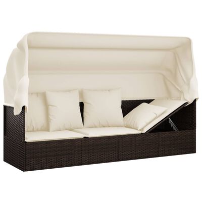 Full outdoor wicker sofa with canopy and multiple cushions.