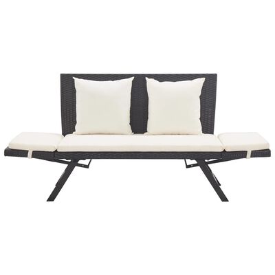 Wicker sofa with cream cushions and two back pillows, seating area visible
