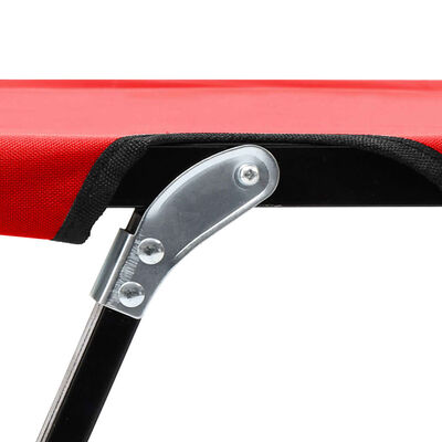 Metal bracket and hinge connection on red table corner