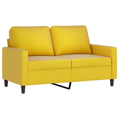 Yellow two-seat sofa with two back cushions and metal accent leg support in front of black frame