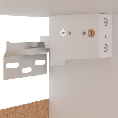 Electrical and mounting hardware close-up for wall cabinet installation.