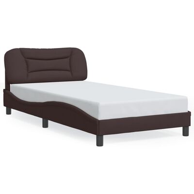A brown upholstered bed with mattress on the frame, no headboard pillows, complete bed setup.
