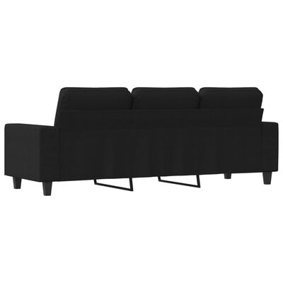 Rear view of a black sectional sofa with metal legs and back cushions.