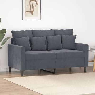 Grey sofa with four back cushions and two seat cushions, pulled-out storage/footrest leg visible under the sofa.