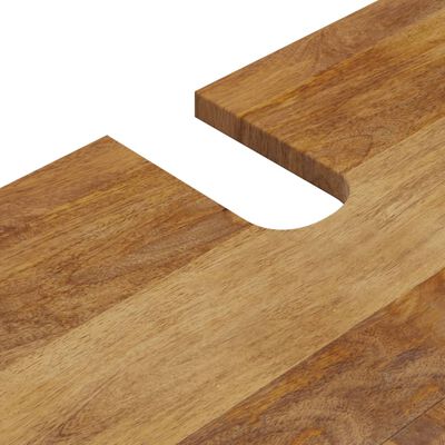 Close-up of wood grain edge with curved cutout details.